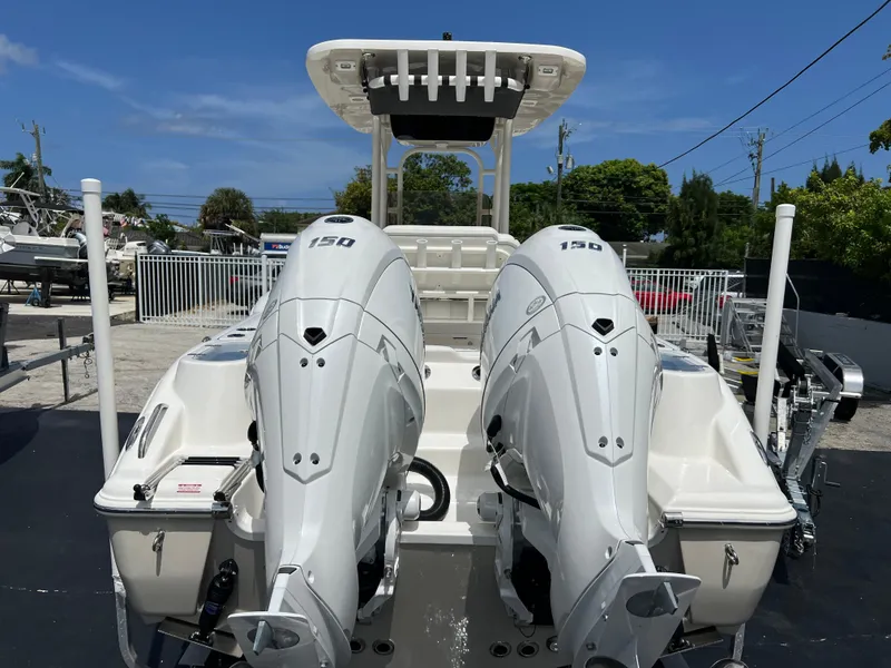 Slide: The Image of 2025 Key West 244 CC boat with twin 150 HP engines, rear view. - 9