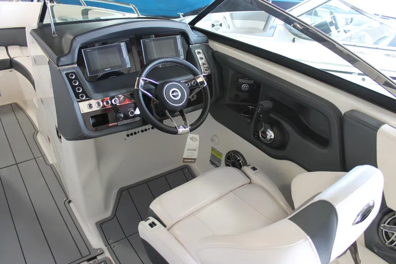 Slide: The Image of 2020 Chaparral 257 SSX boat cockpit with modern dashboard and steering wheel. - 7