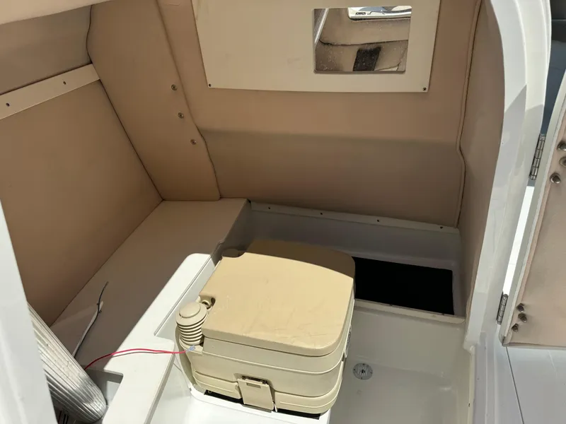Slide: The Image of Interior cabin of a 2001 Cobalt 25 LS boat with portable toilet. - 13
