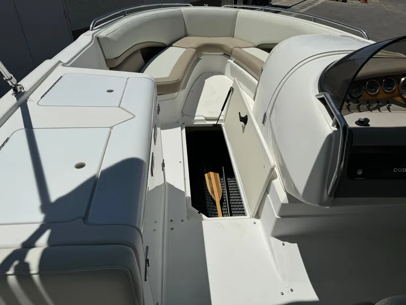 Slide: The Image of 2001 Cobalt 25 LS boat interior with seating and storage compartments. - 14