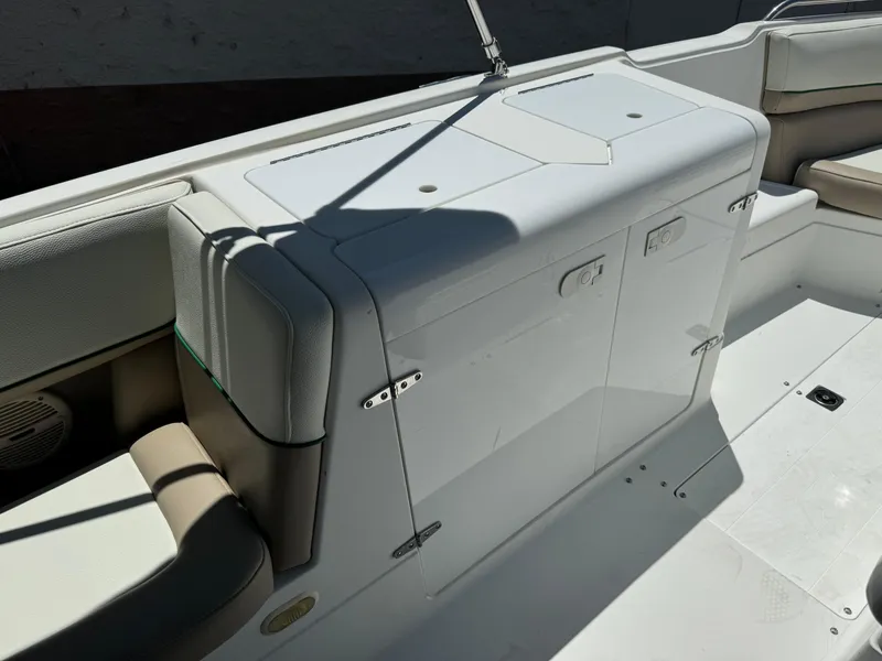 Slide: The Image of 2001 Cobalt 25 LS boat interior with white and beige seating. - 15