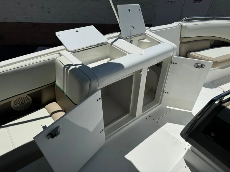 Slide: The Image of 2001 Cobalt 25 LS boat interior with open storage compartments and sink. - 16