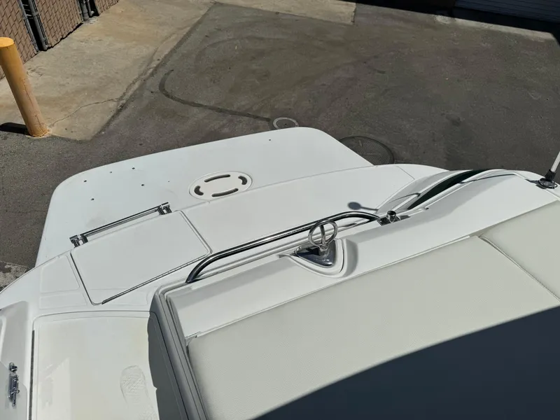 Slide: The Image of 2001 Cobalt 25 LS boat deck and seating area in a parking lot. - 21