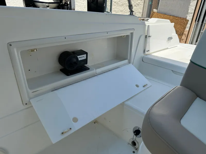 Slide: The Image of 2001 Cobalt 25 LS boat storage compartment with open hatch. - 22