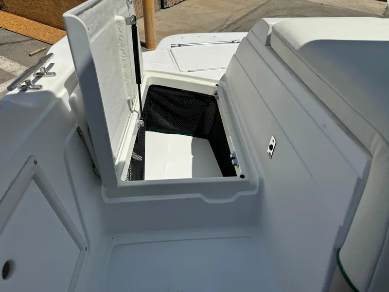 Slide: The Image of Open storage compartment on a 2001 Cobalt 25 LS boat. - 23