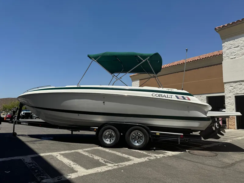 Slide: The Image of 2001 Cobalt 25 LS boat on a trailer with green canopy. - 4