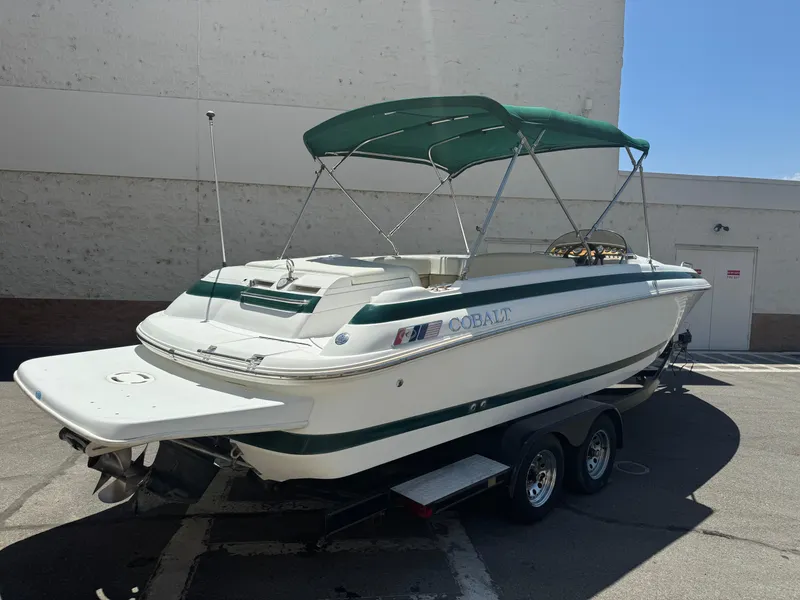 Slide: The Image of 2001 Cobalt 25 LS boat with green canopy on a trailer. - 6