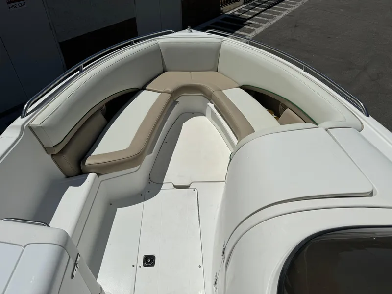 Slide: The Image of 2001 Cobalt 25 LS boat interior with cushioned seating. - 9