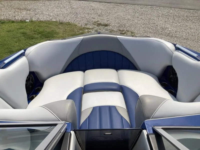 Slide: The Image of 2016 MB B52 23 boat interior with blue and white seating. - 16