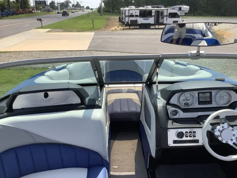 Slide: The Image of Interior of a 2016 MB B52 23 boat with dashboard and seating. - 18