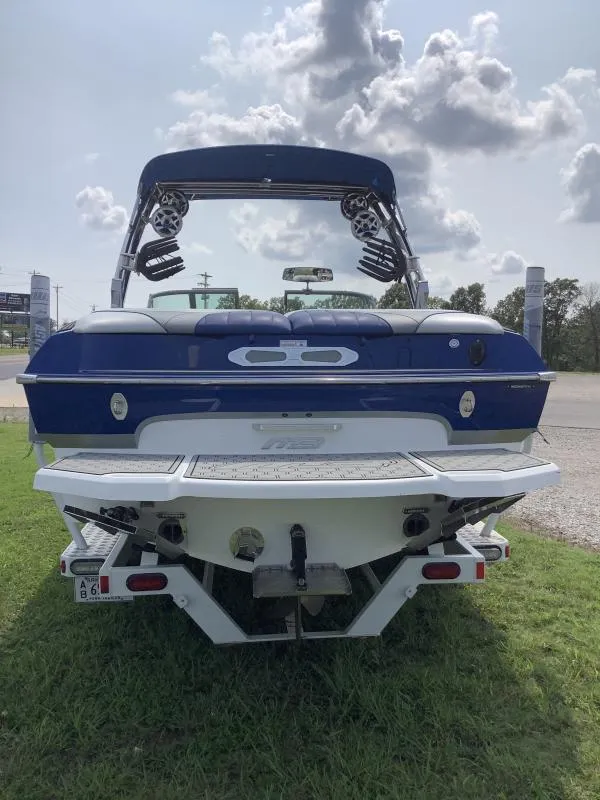 Slide: The Image of Rear view of a 2016 MB B52 23 boat on a grassy area. - 5