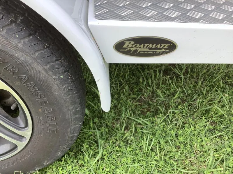 Slide: The Image of Boatmate trailer tire and step, MB B52 23 model, 2016, on grass. - 6