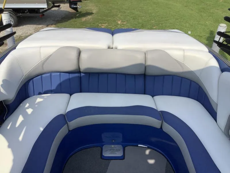 Slide: The Image of 2016 MB B52 23 boat with blue and white cushioned seating. - 8