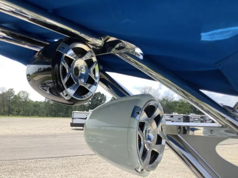 Slide: The Image of Close-up of MB B52 23 boat speakers, 2016 model, under blue canopy. - 9