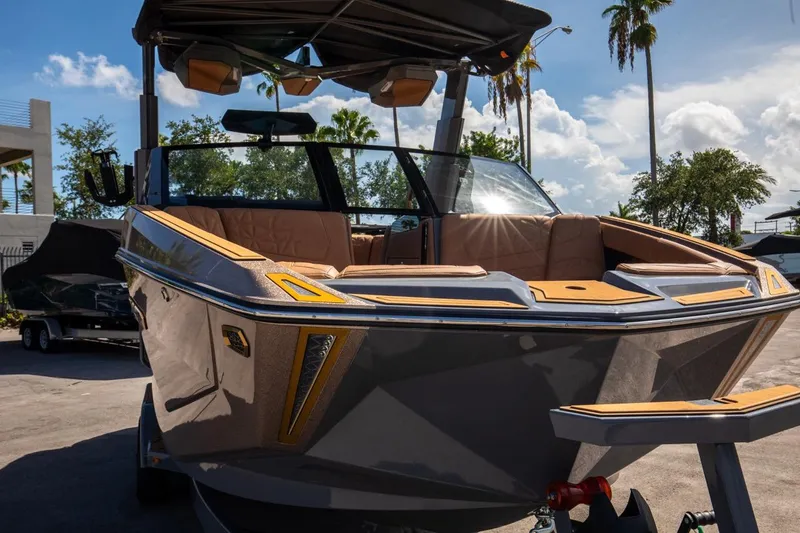 Slide: The Image of 2024 Nautique G23 boat with sleek design and luxurious interior. - 14