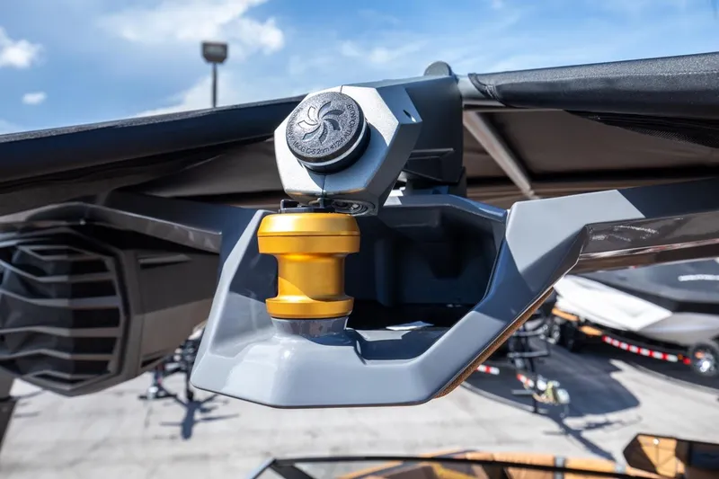 Slide: The Image of Close-up of 2024 Nautique G23 boat tower with gold anodized hardware. - 20