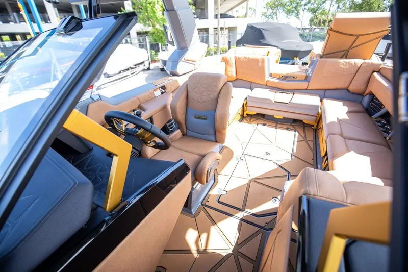 Slide: The Image of 2024 Nautique G23 boat interior with luxurious seating and modern design. - 28