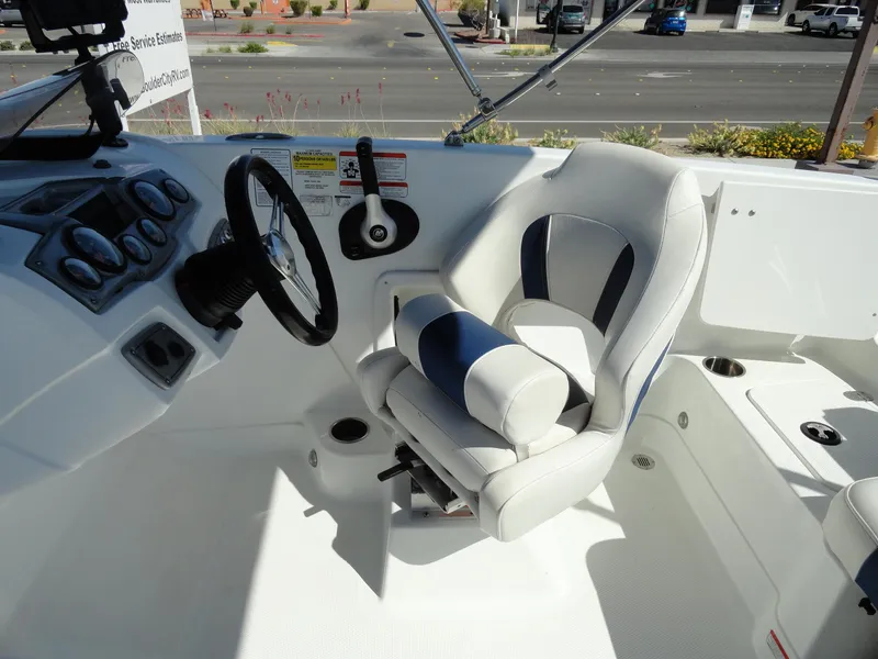 Slide: The Image of Tahoe 1950 boat cockpit with steering wheel and captain's chair, 2020 model. - 10