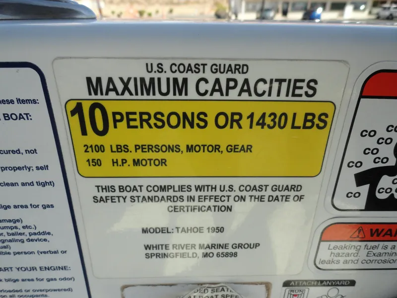 Slide: The Image of U.S. Coast Guard maximum capacities label on 2020 Tahoe 1950 boat. - 11