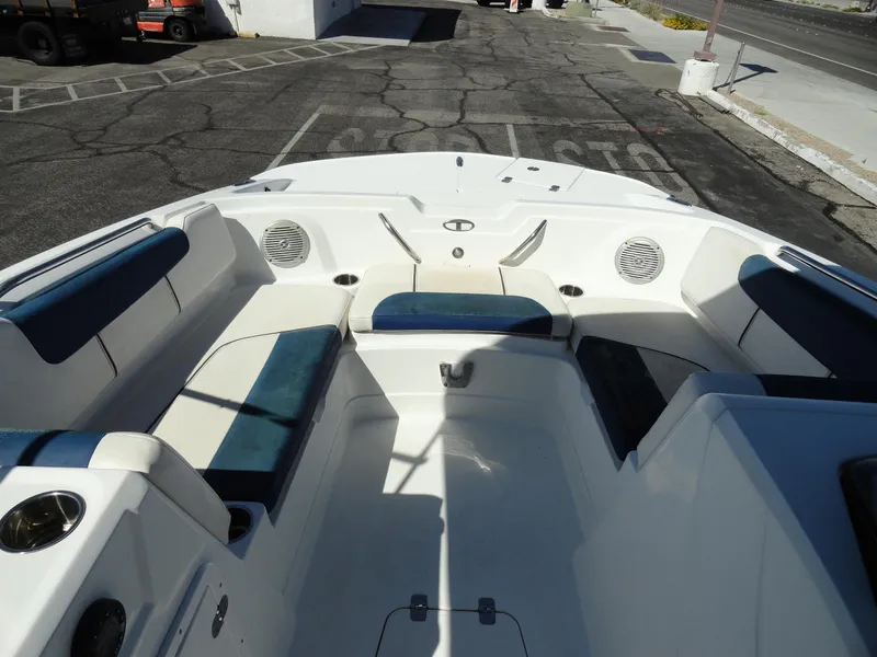 Slide: The Image of Interior of a 2020 Tahoe 1950 boat with white and blue seating. - 13