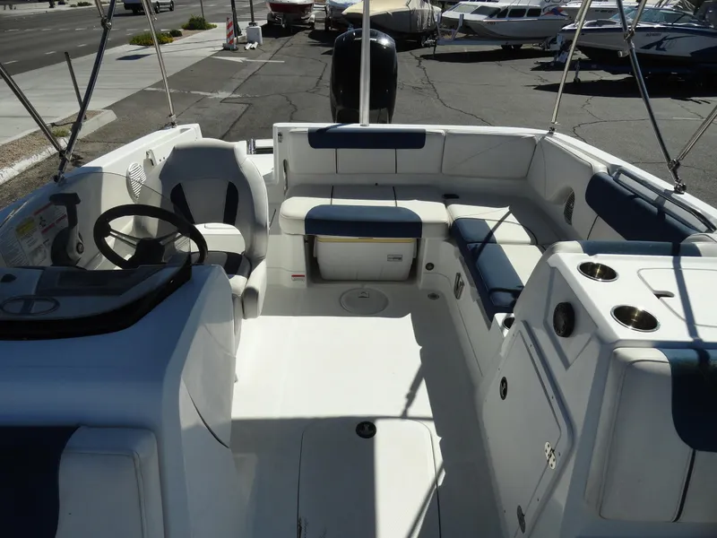 Slide: The Image of Interior of a 2020 Tahoe 1950 boat with seating and steering wheel. - 15