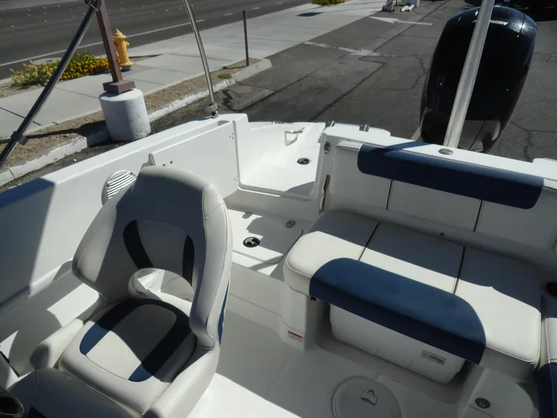 Slide: The Image of Interior of a 2020 Tahoe 1950 boat with seating and steering area. - 17