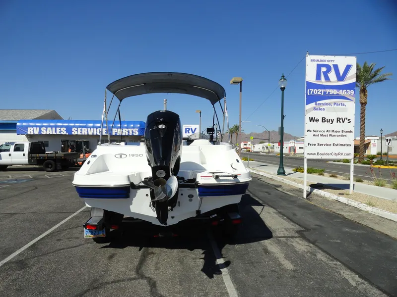 Slide: The Image of Tahoe 1950 boat, 2020 model, parked near RV sales and service center. - 21