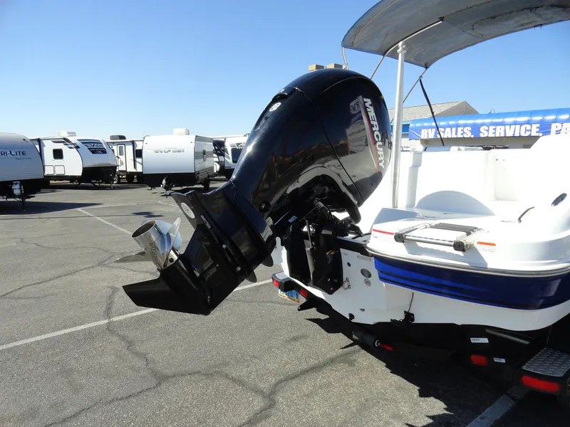 Slide: The Image of Tahoe 1950 boat (2020) with Mercury outboard motor in a dealership lot. - 22