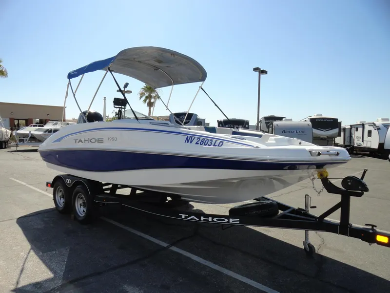 Slide: The Image of 2020 Tahoe 1950 boat on trailer in parking lot. - 3