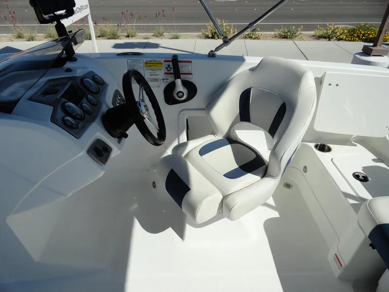 Slide: The Image of 2020 Tahoe 1950 boat cockpit with steering wheel and captain's chair. - 9