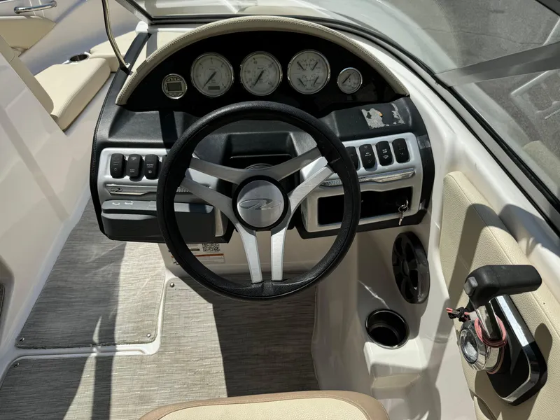Slide: The Image of 2019 Regal 1900 ES Bowrider dashboard with steering wheel and control panel. - 17