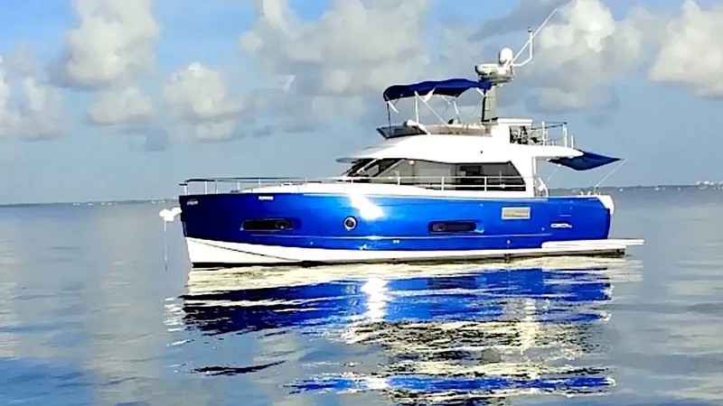 The Image of Azimut Magellano 43 yacht, 2014 model, in calm waters under a partly cloudy sky. - 0