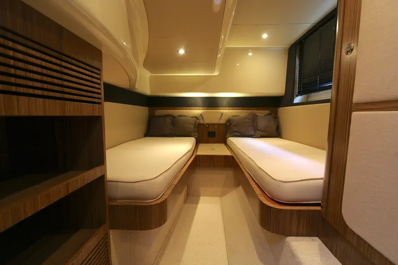 Slide: The Image of Luxurious interior of 2014 Azimut Magellano 43 yacht with twin beds and elegant wood finish. - 10