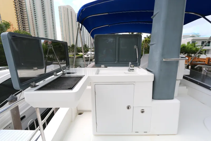 Slide: The Image of Outdoor kitchen on 2014 Azimut Magellano 43 yacht with grill and sink. - 18