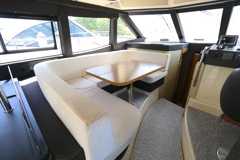 Slide: The Image of Interior of 2014 Azimut Magellano 43 yacht with elegant dining area and panoramic windows. - 3