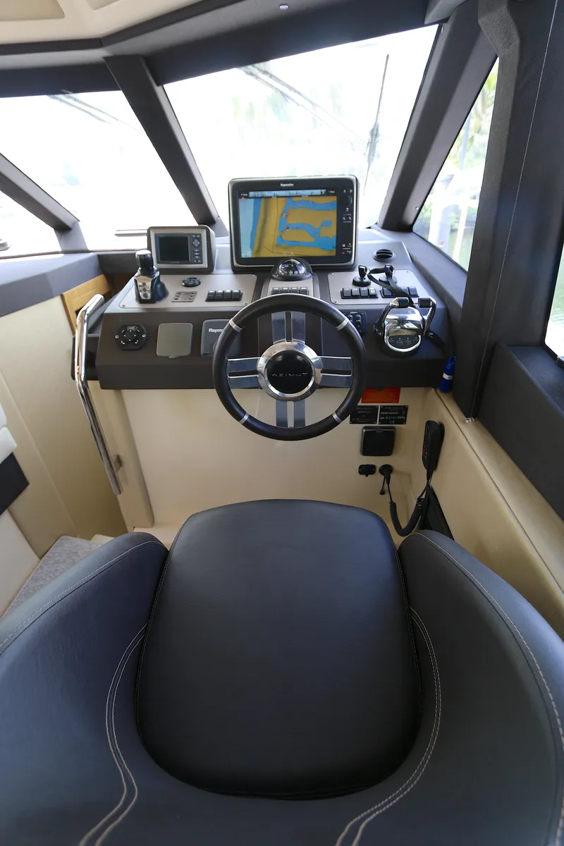 Slide: The Image of Cockpit of 2014 Azimut Magellano 43 yacht with navigation equipment and steering wheel. - 5