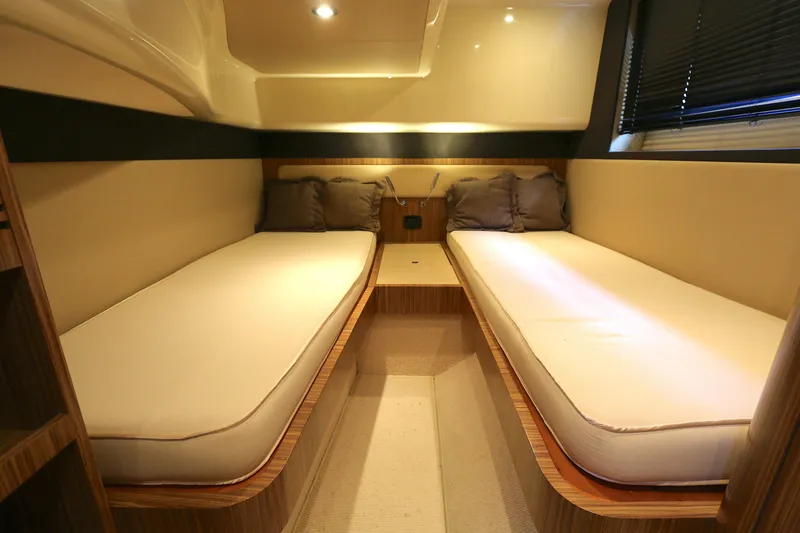 Slide: The Image of Interior cabin of 2014 Azimut Magellano 43 yacht with twin beds and cushions. - 9