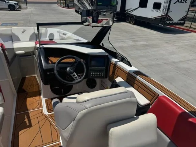 Slide: The Image of 2020 ATX Boats 24 TYPE-S cockpit with modern controls and luxurious seating. - 12