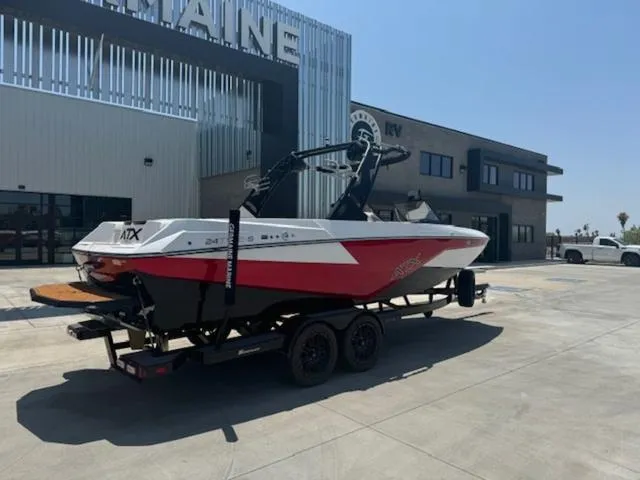 Slide: The Image of 2020 ATX Boats 24 TYPE-S on trailer outside a modern building. - 3