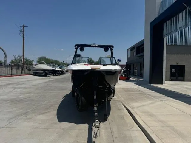 Slide: The Image of 2020 ATX Boats 24 TYPE-S on a trailer in a parking lot. - 7