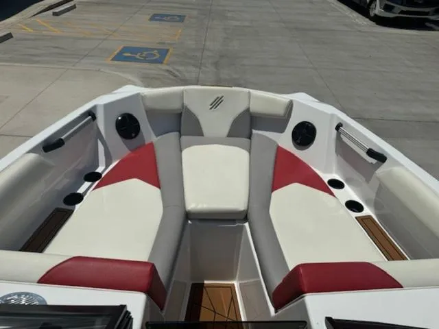 Slide: The Image of 2020 ATX Boats 24 TYPE-S interior with red and white seating, cup holders, and speakers. - 9