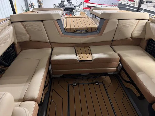 Slide: The Image of 2025 Nautique Super Air Nautique G23 interior seating and deck. - 13
