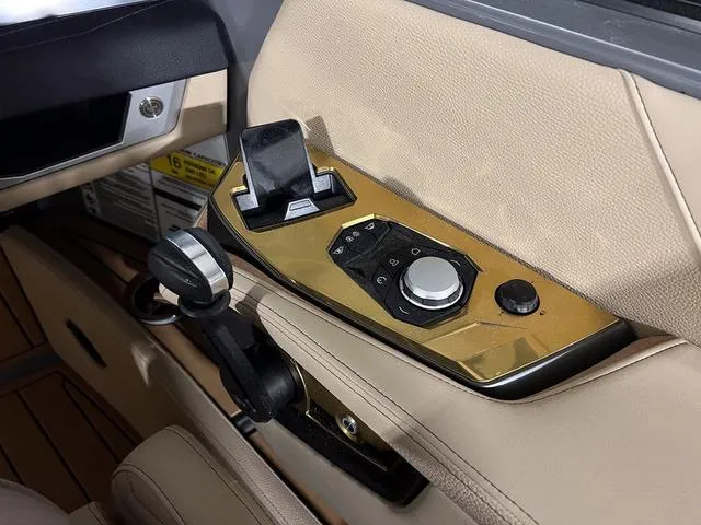 Slide: The Image of 2025 Nautique Super Air Nautique G23 control panel with joystick and touchscreen. - 22