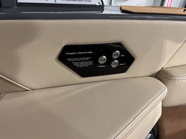 Slide: The Image of 2025 Nautique Super Air Nautique G23 tower controls on beige interior panel. - 23