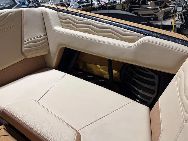 Slide: The Image of 2025 Nautique Super Air Nautique G23 interior seating with beige upholstery. - 29