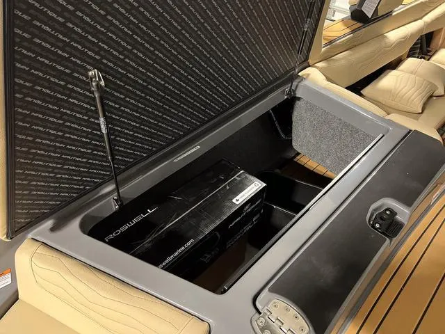 Slide: The Image of 2025 Nautique Super Air Nautique G23 storage compartment with Roswell equipment. - 9