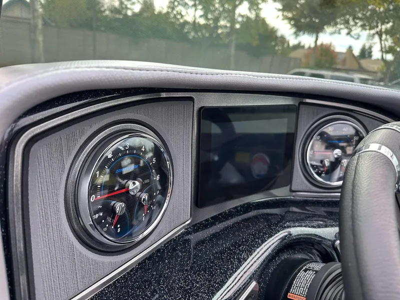 Slide: The Image of 2024 Sanger V237 SX dashboard with gauges and digital display. - 11