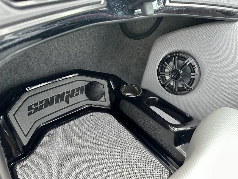 Slide: The Image of 2024 Sanger V237 SX boat interior with speaker and cup holder. - 12