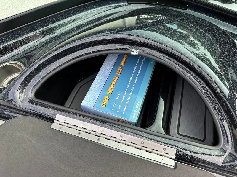 Slide: The Image of 2024 Sanger V237 SX storage compartment with a blue box inside. - 22