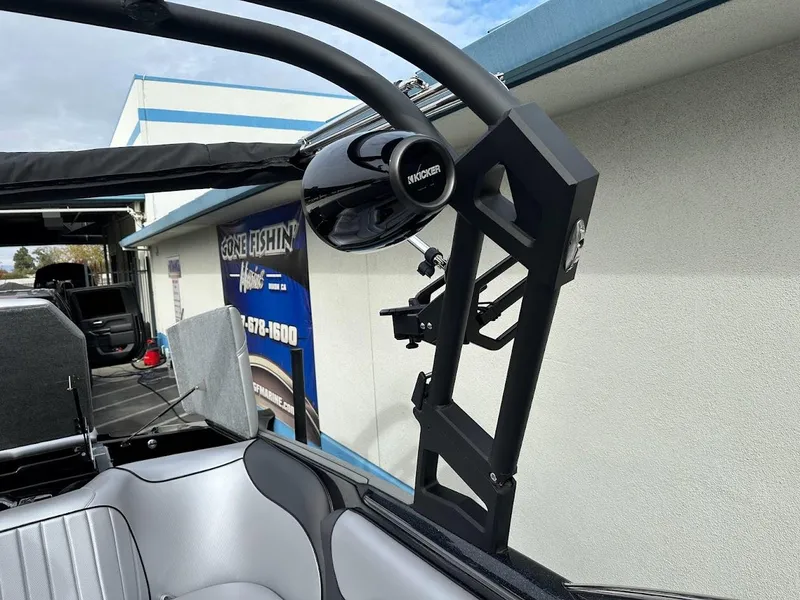 Slide: The Image of 2024 Sanger V237 SX boat with tower speaker and sleek interior design. - 23